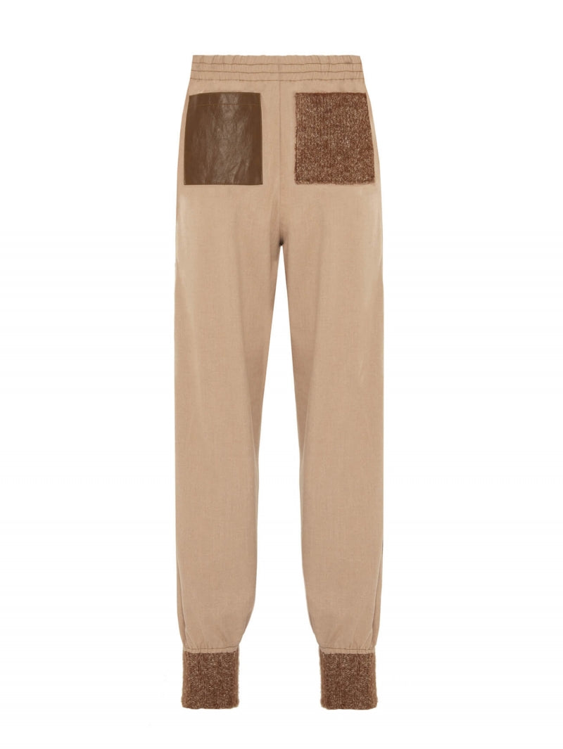 Pantaloni con inserto in eco-pelle e maglia